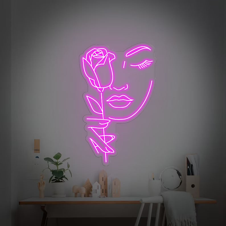 Volto femminile rosa neon