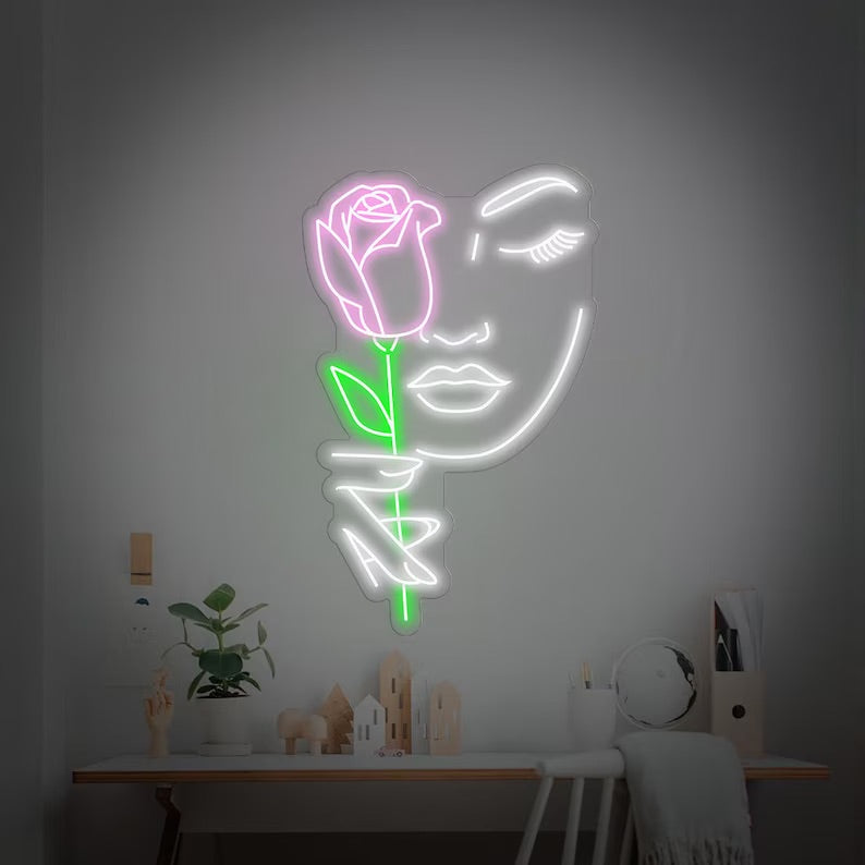 Volto femminile rosa neon