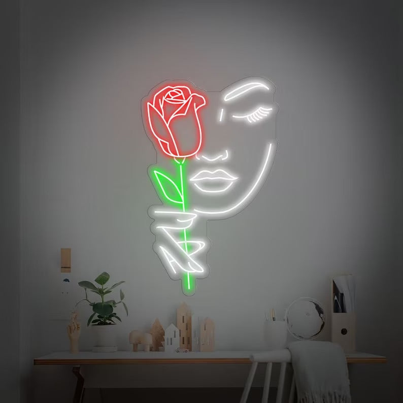 Volto femminile rosa neon