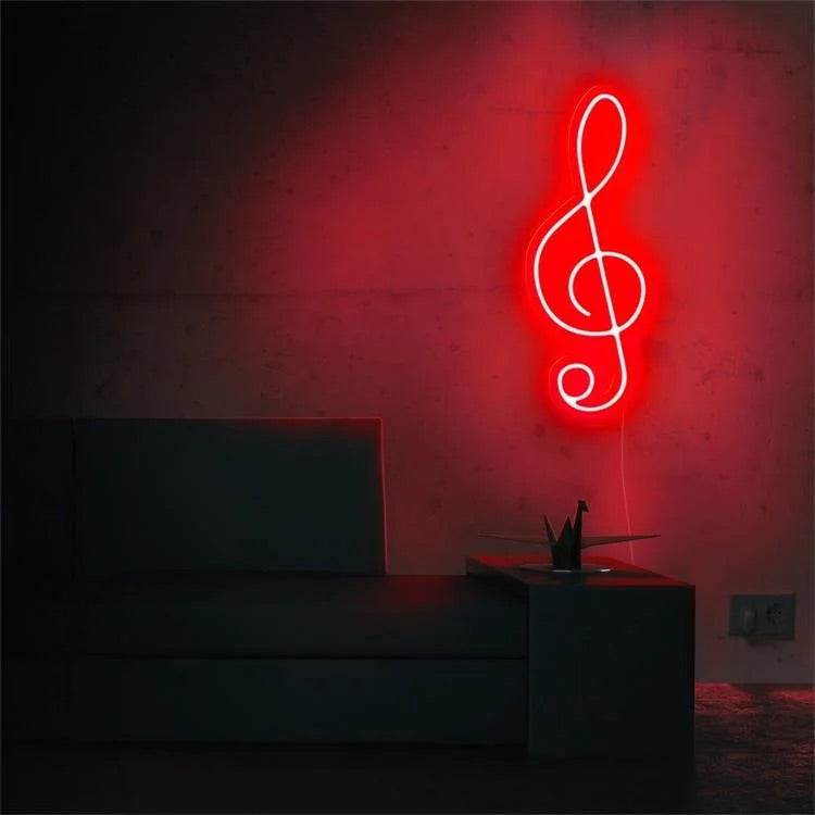 Neon red treble clef music note light mounted on wall above sofa
