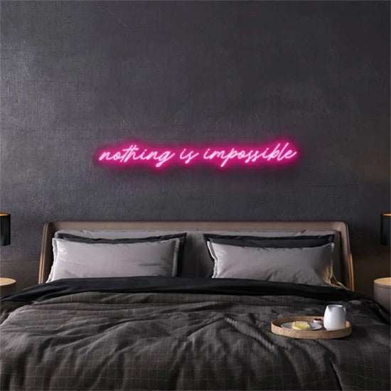 nothing is impossible neon pink sign above bed in modern bedroom