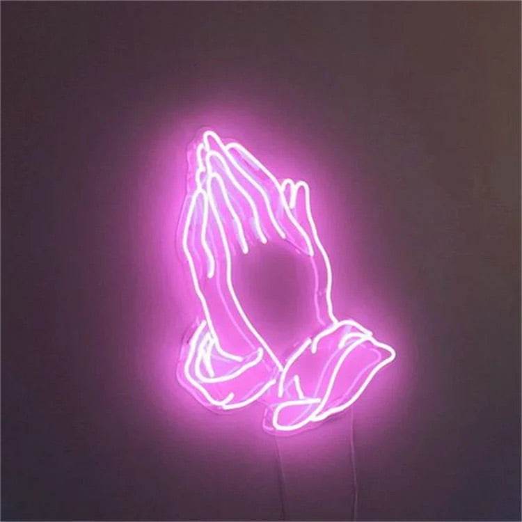 Neon preghiera mano glowing pink light sign on wall