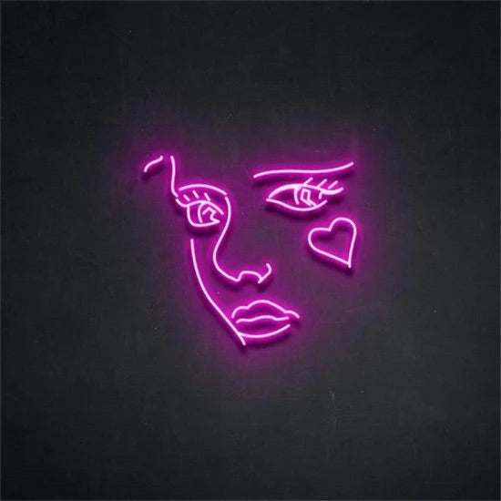 neon pink volto donna cuore outline sign on black background