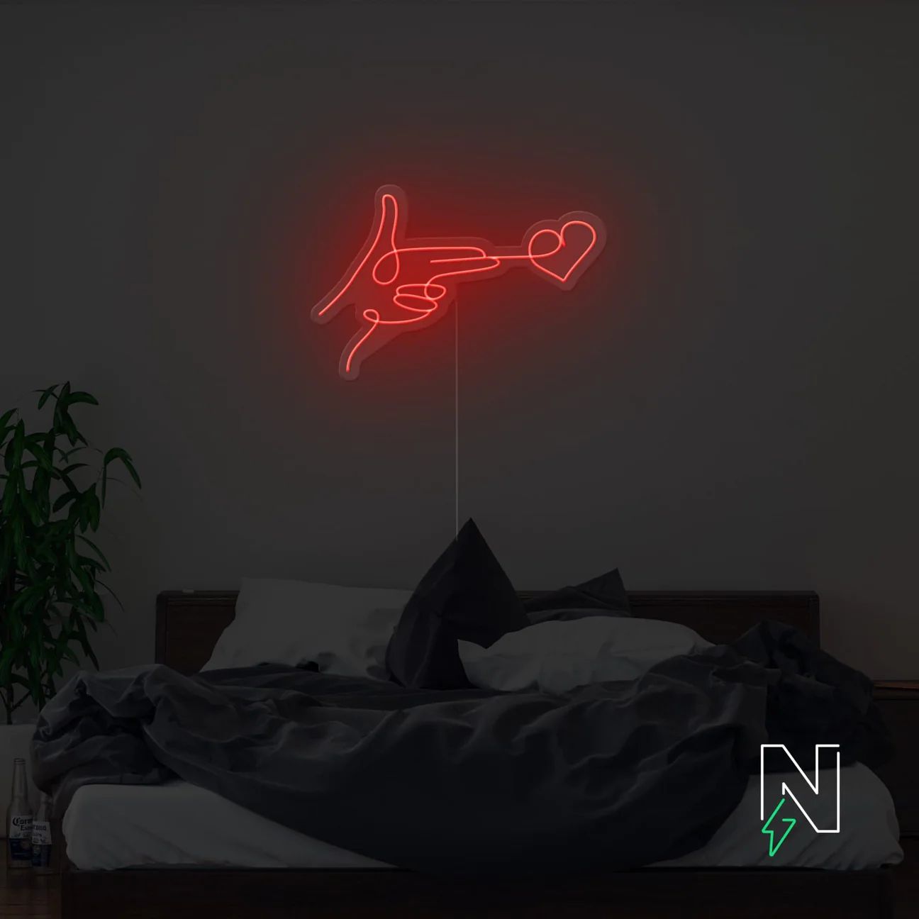 Mano con cuore sparo neon